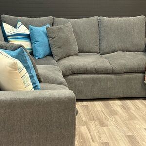 Living Spaces Gray Sectional with Blue and Cream Accents